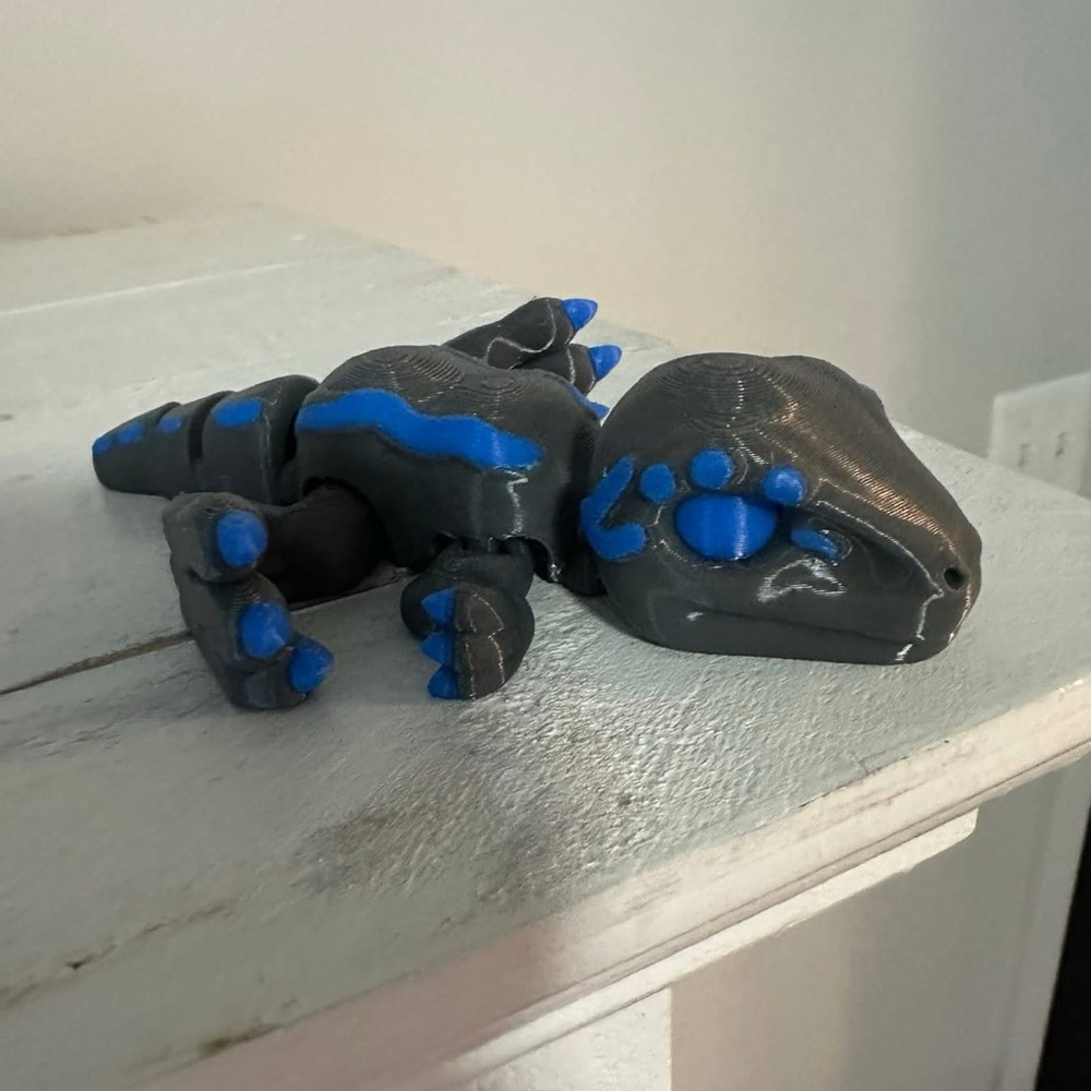 Gray and Blue Dinosaur Figurine